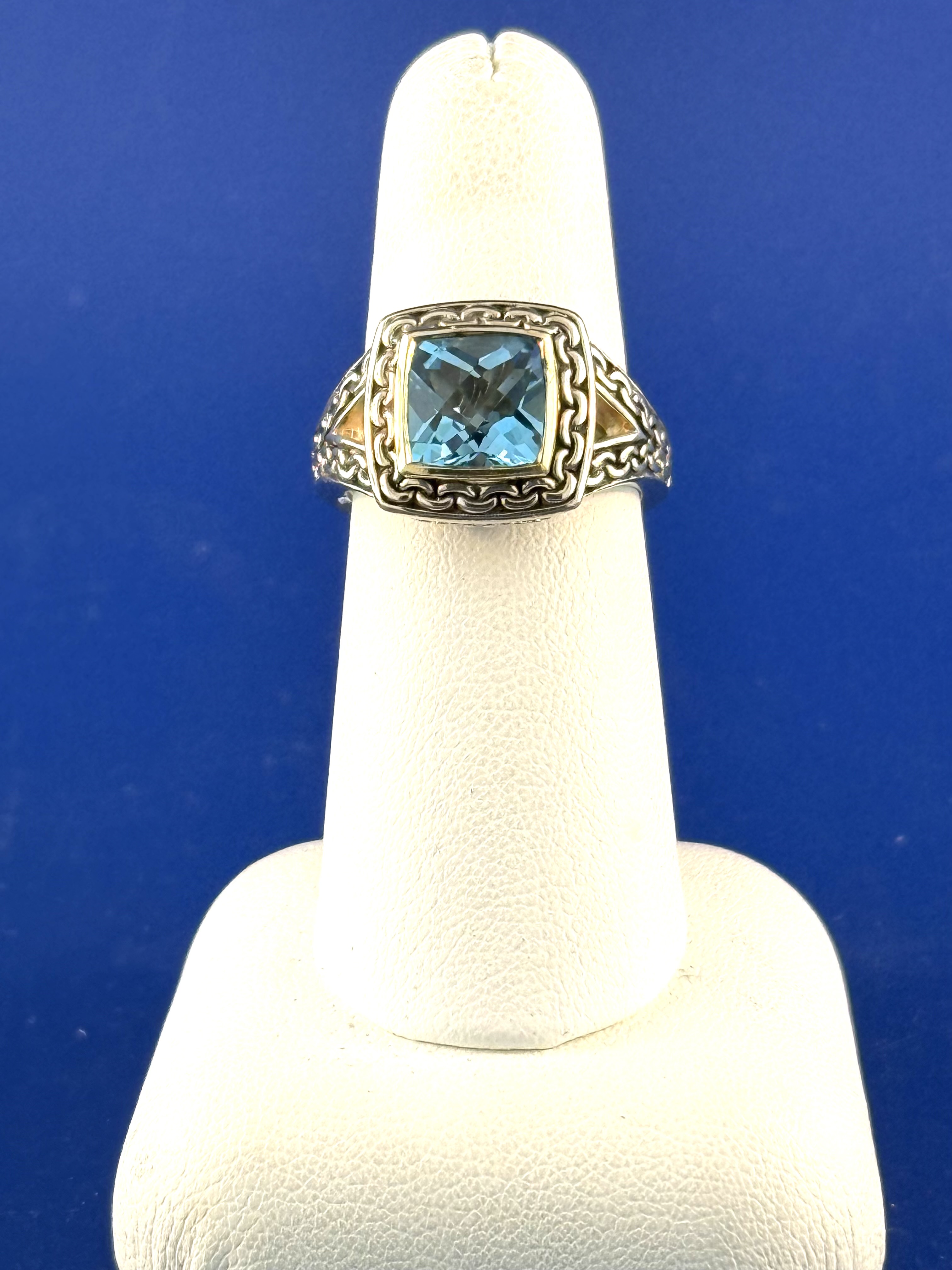 Sterling silver and 18 kt blue topaz ring