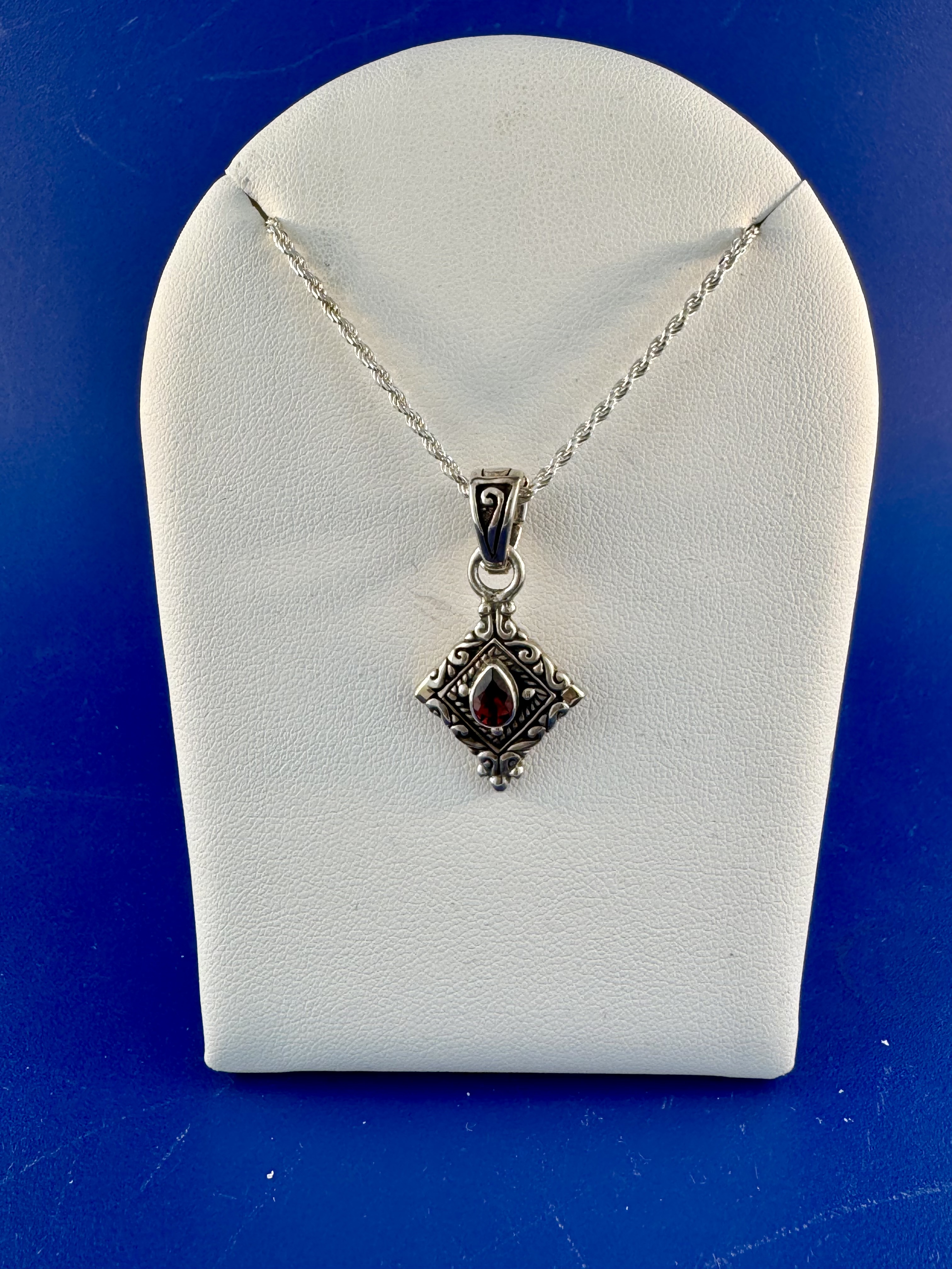 Sterling silver and 18 kt garnet pendant