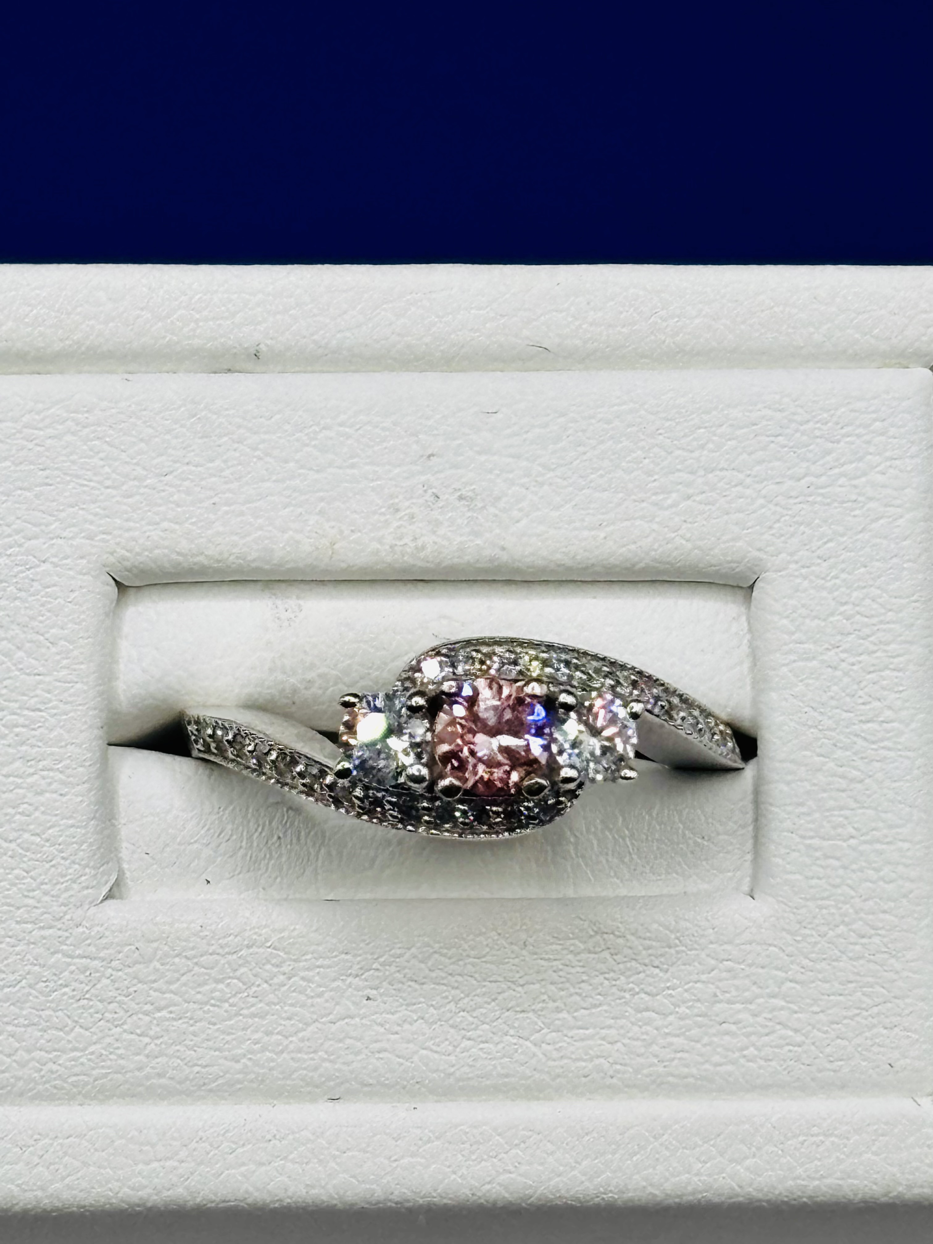 Fancy Vivid Pink Three Stone Diamond Ring